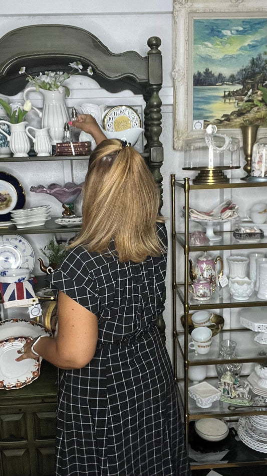 Eva Ruiz of Home Style Treasures curating vintage and antique home décor pieces