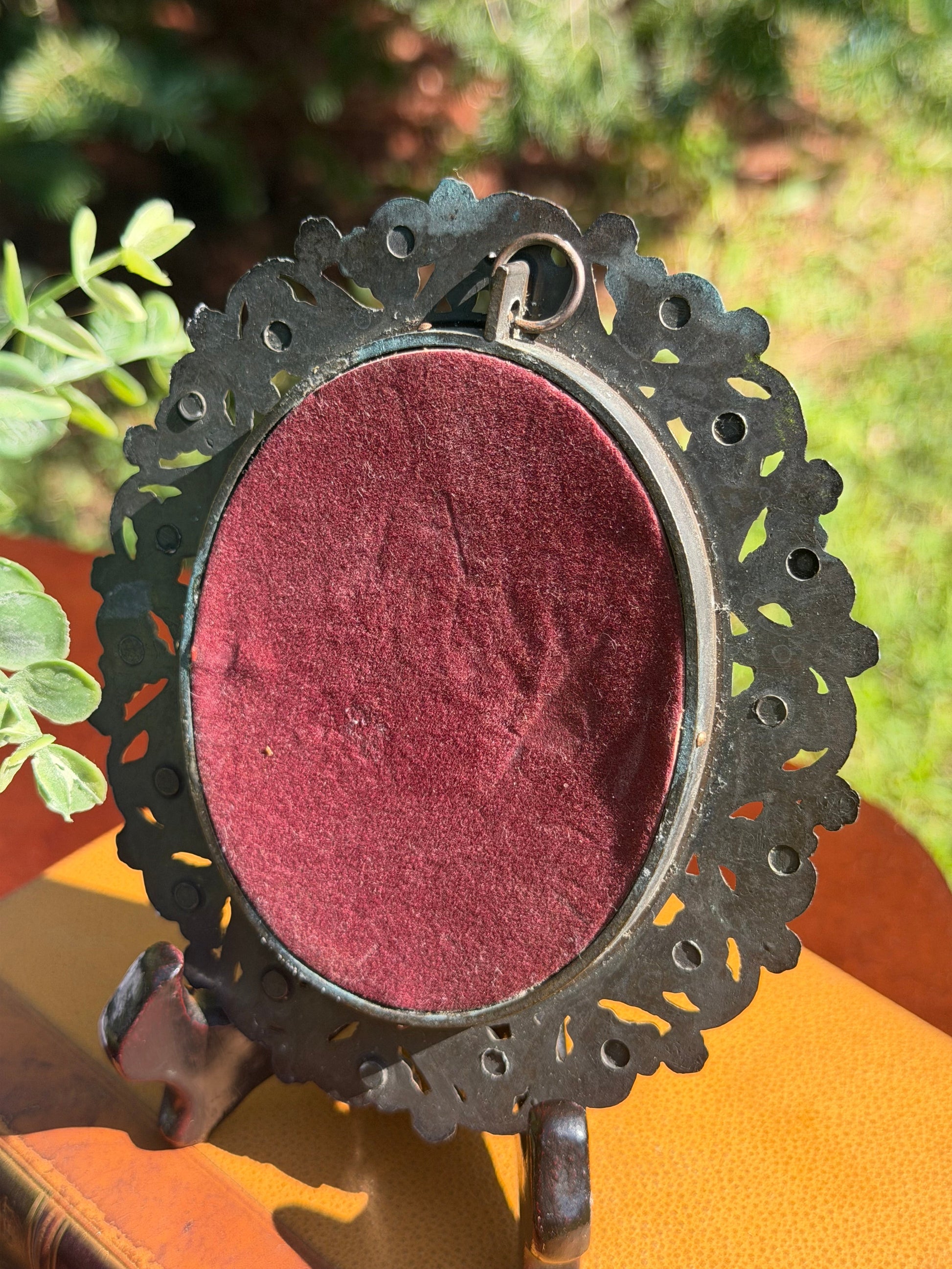 Antique miniature portrait of 18th century noblewoman in brass filigree frame, front view