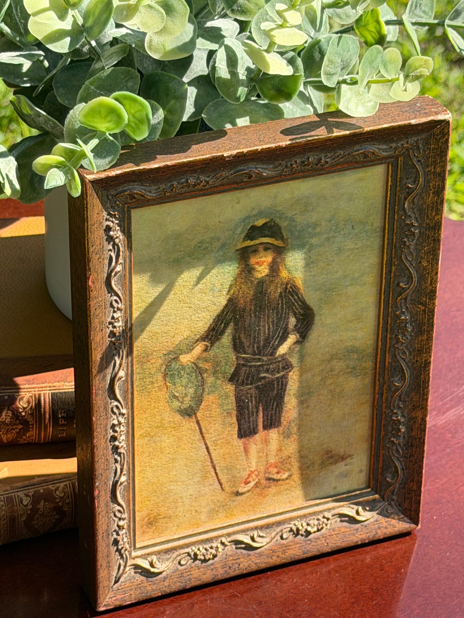 Close-up of Renoir Fisher Boy print showing young girl in striped suit with fishing net and cane