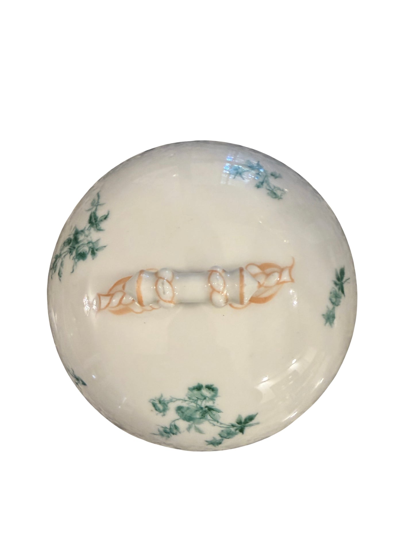 Antique ivory porcelain dome lid with scattered blue floral and green ivy pattern and bisque rope-twist handle