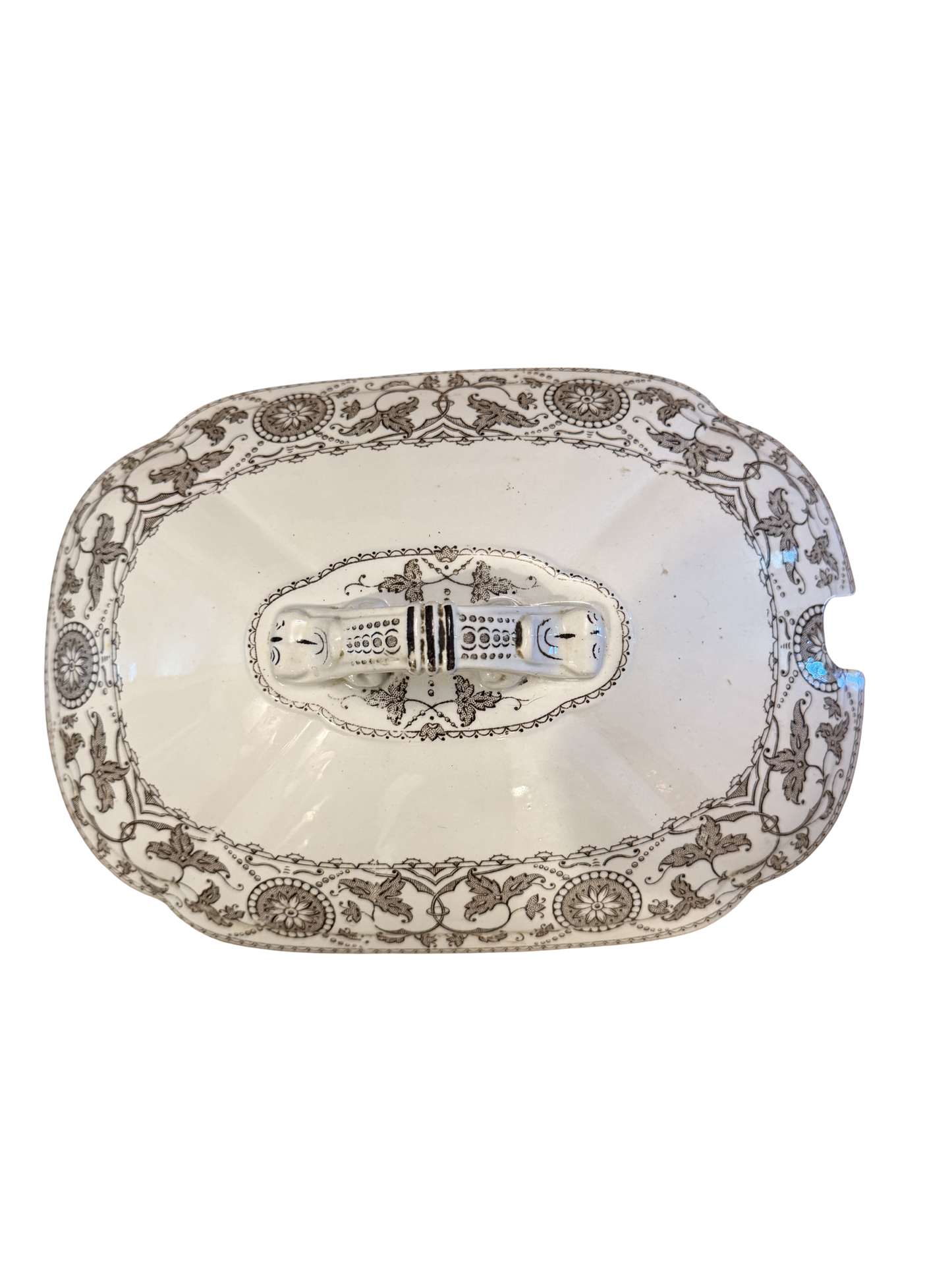 Antique white ironstone tureen lid with grey neoclassical transferware pattern featuring griffins, scrolling vines, and ornate double-handled finial