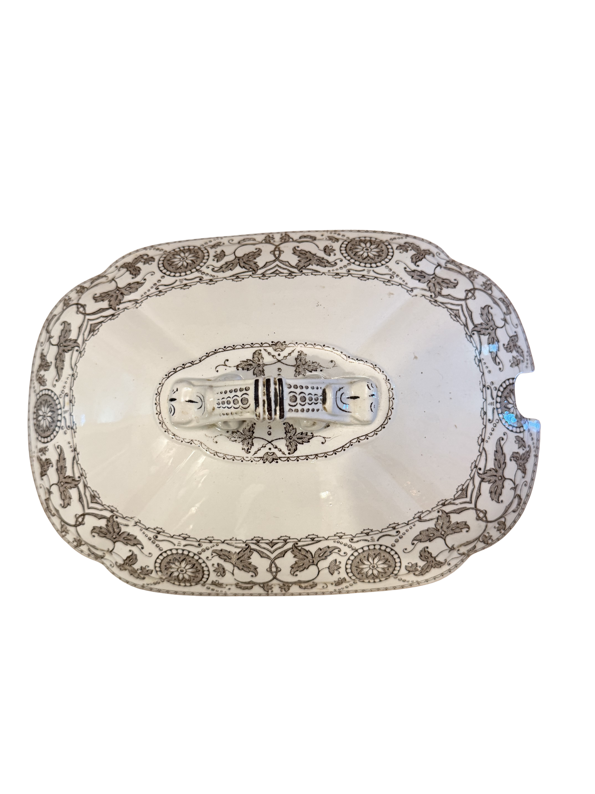Antique white ironstone tureen lid with grey neoclassical transferware pattern featuring griffins, scrolling vines, and ornate double-handled finial