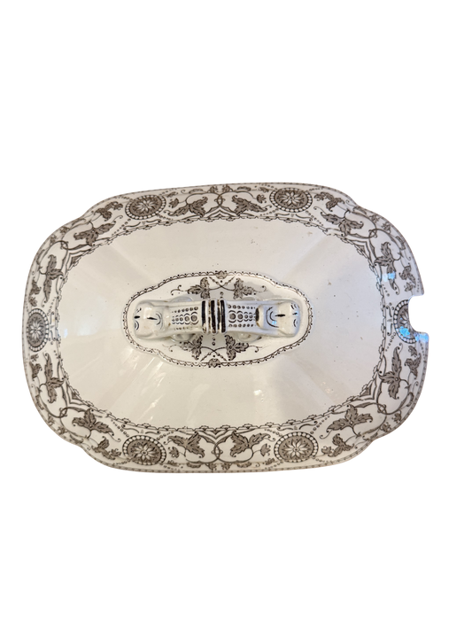 Antique white ironstone tureen lid with grey neoclassical transferware pattern featuring griffins, scrolling vines, and ornate double-handled finial