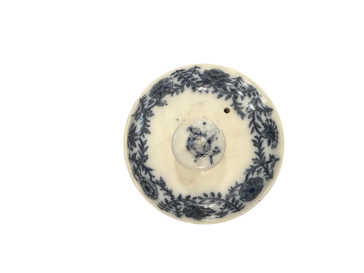Antique blue and white transferware circular lid with dense floral wreath border and rose knop finial
