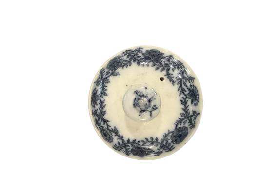 Antique blue and white transferware circular lid with dense floral wreath border and rose knop finial